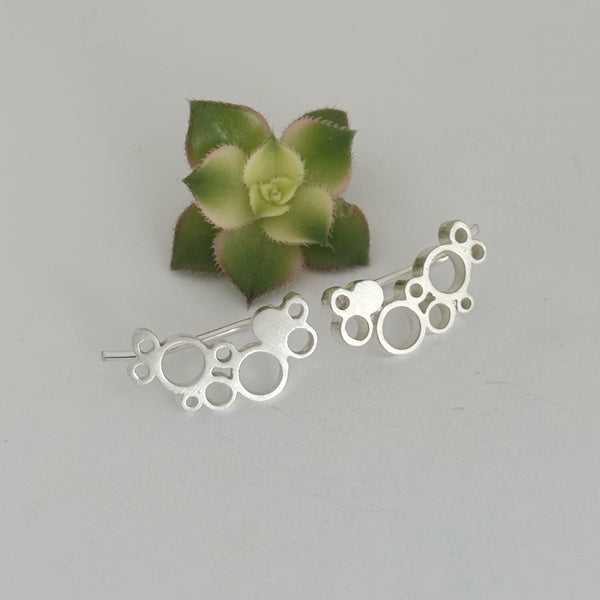 Dot Holly silver climber earrings