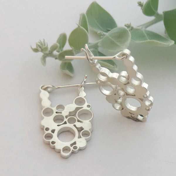 Oval lace silver hoops