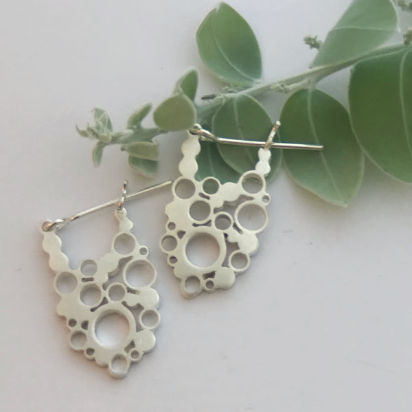 Oval lace silver hoops