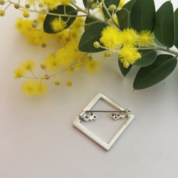Square brooch with circle detail stainless steel pin